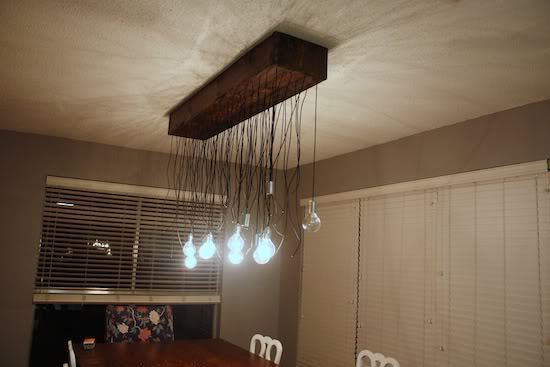 Partially-completed DIY light fixture hung on the ceiling.