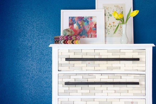 You won't even believe how simple and affordable it is to make this gorgeous West Elm-inspired DIY wood-tiled dresser. The tutorial is incredibly thorough, and the end result is absolutely stunning! 