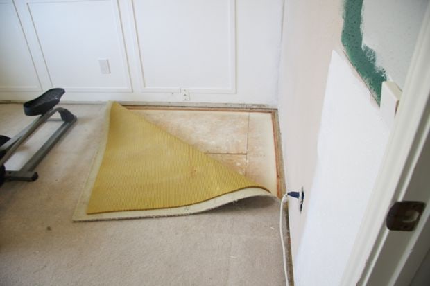 ripping up carpet to install luxury vinyl plank flooring