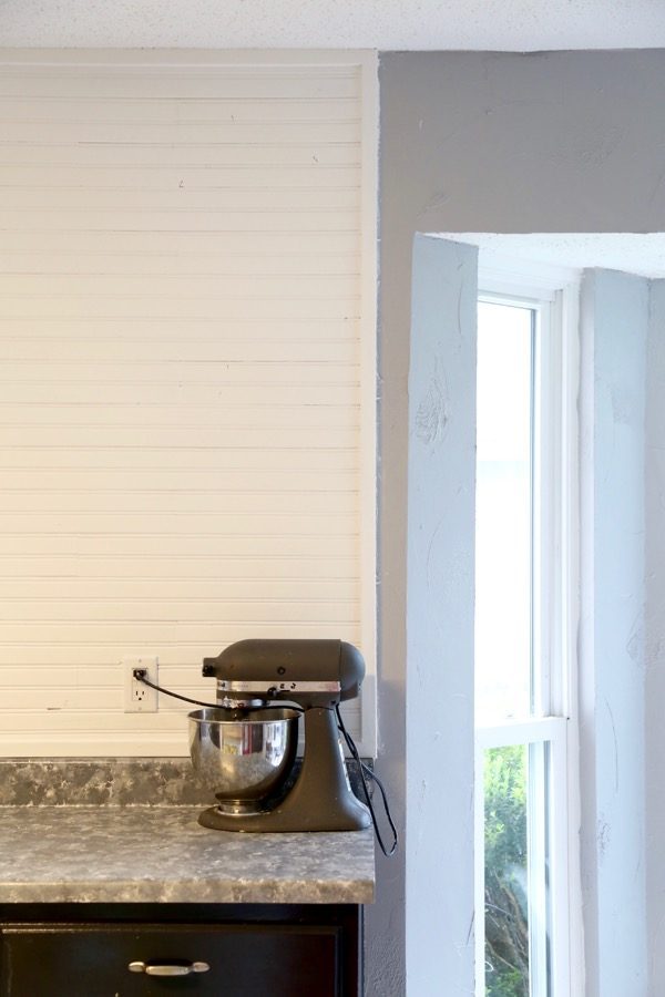 Closeup image of beadboard backsplash in kitchen