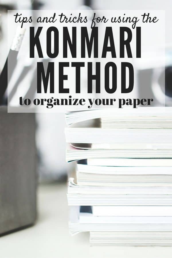 Stack of papers with text overlay - Tips and Tricks for using the Konmari Method to Organize Your Paper