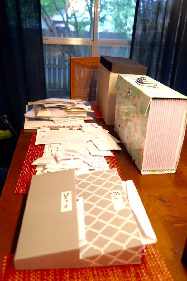 Papers and files in a pile on a table