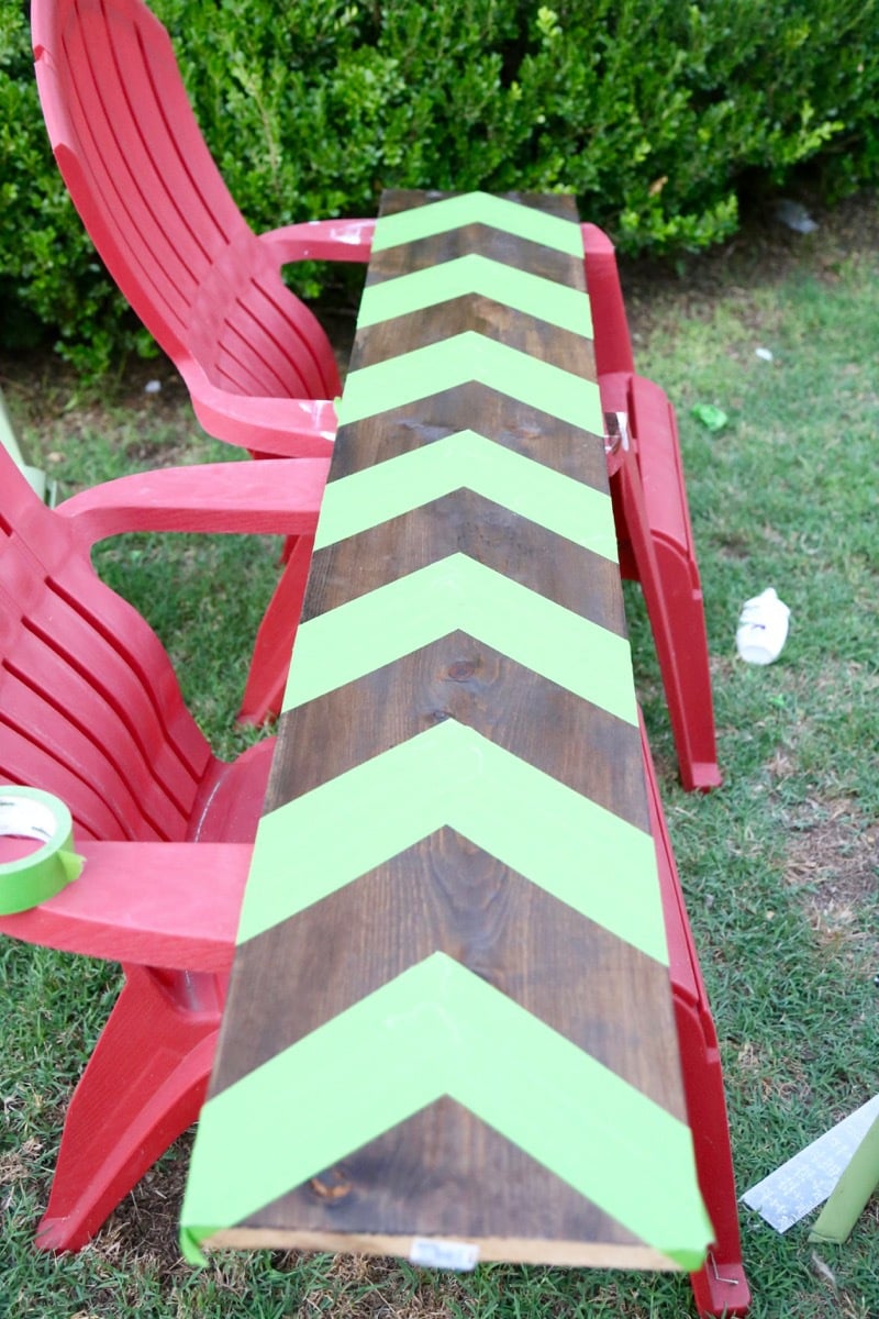 Chevron stripes taped off on a wooden growth chart