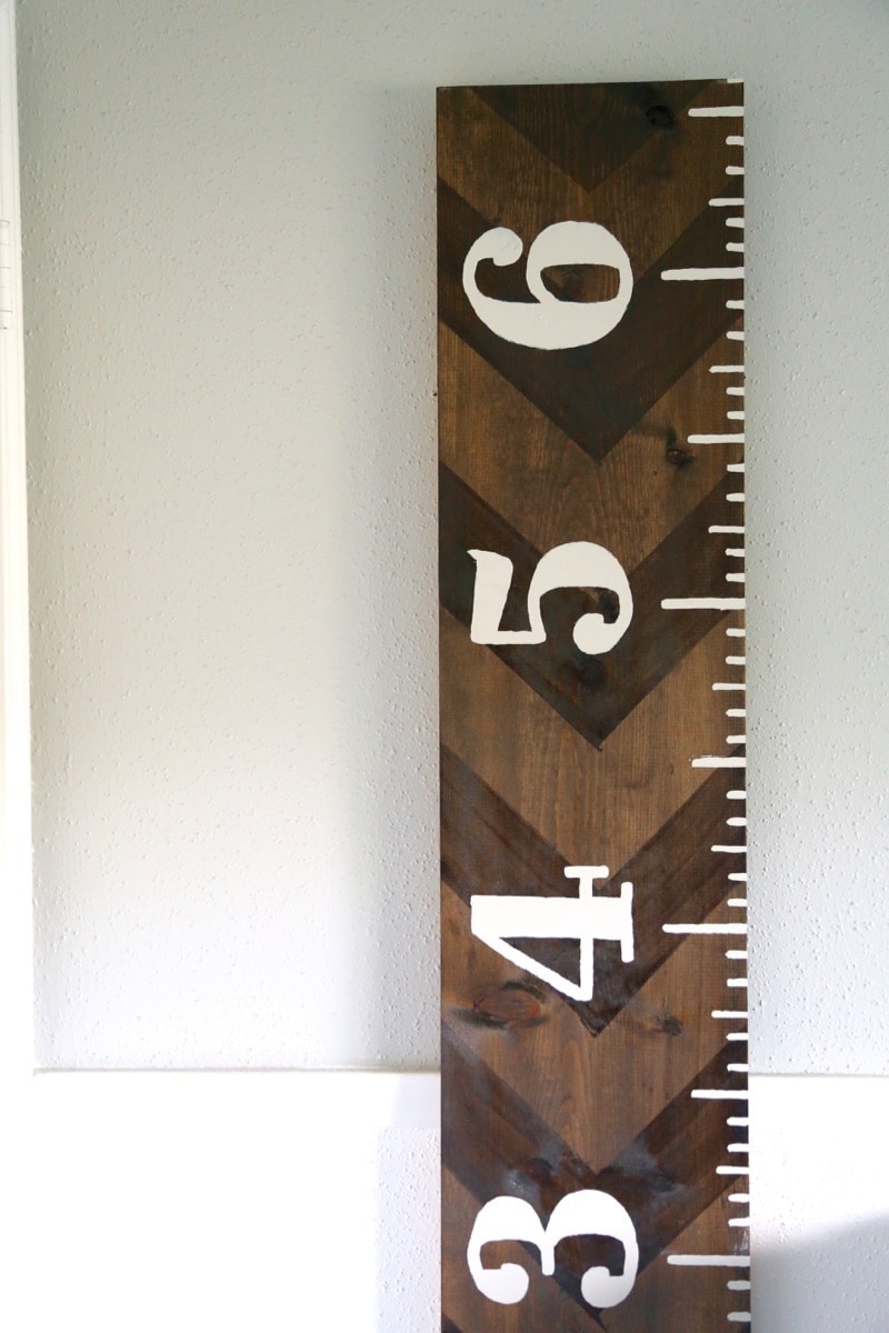 close up image of wooden ruler growth chart