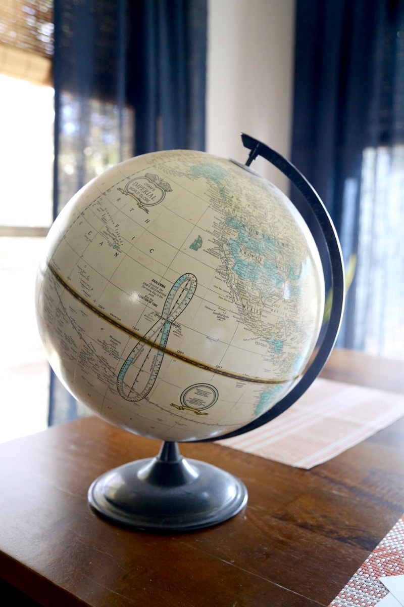 I LOVE this globe art! It's so cute and so incredibly easy to make! Learn how to make your own in under and hour and for just a couple of bucks - this is seriously one of the simplest DIY projects ever! 