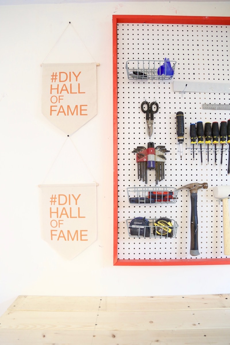 organizing tools on pegboard