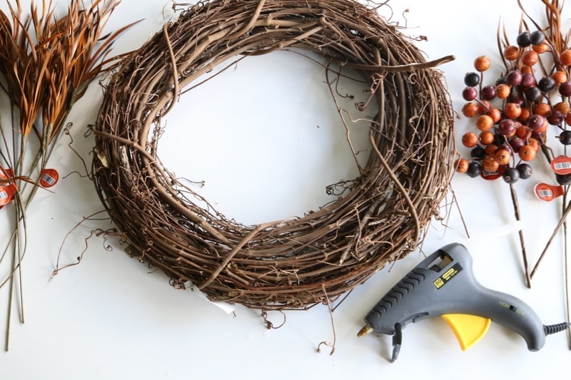 It doesn't have to be hard or expensive to decorate your home for fall! Here's a quick and easy DIY fall wreath idea - it'll only take you a few minutes to put together, and it's super affordable. 