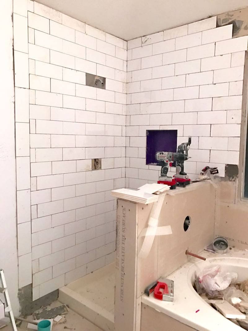 This bathroom renovation is going to be amazing. The black and white tile in this room is so clean and modern! There are some great tips for tiling in this post, too. This One Room Challenge makeover is going to be absolutely amazing.