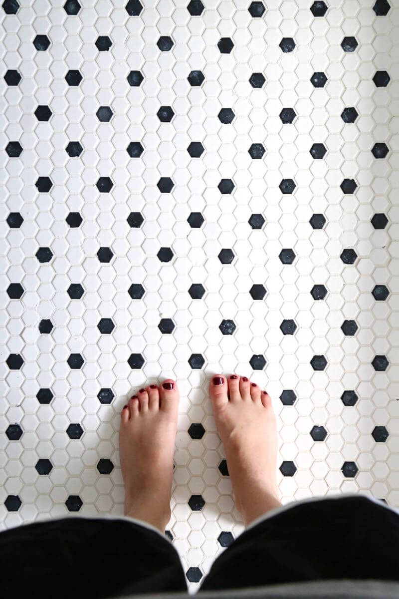 This bathroom renovation is going to be amazing. The black and white tile in this room is so clean and modern! There are some great tips for tiling in this post, too. This One Room Challenge makeover is going to be absolutely amazing.