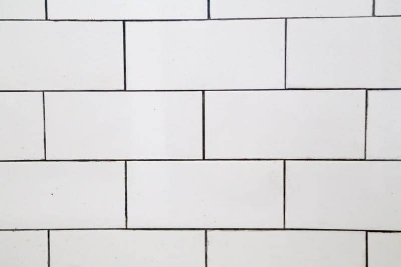This bathroom renovation is going to be amazing. The black and white tile in this room is so clean and modern! There are some great tips for tiling in this post, too. This One Room Challenge makeover is going to be absolutely amazing.