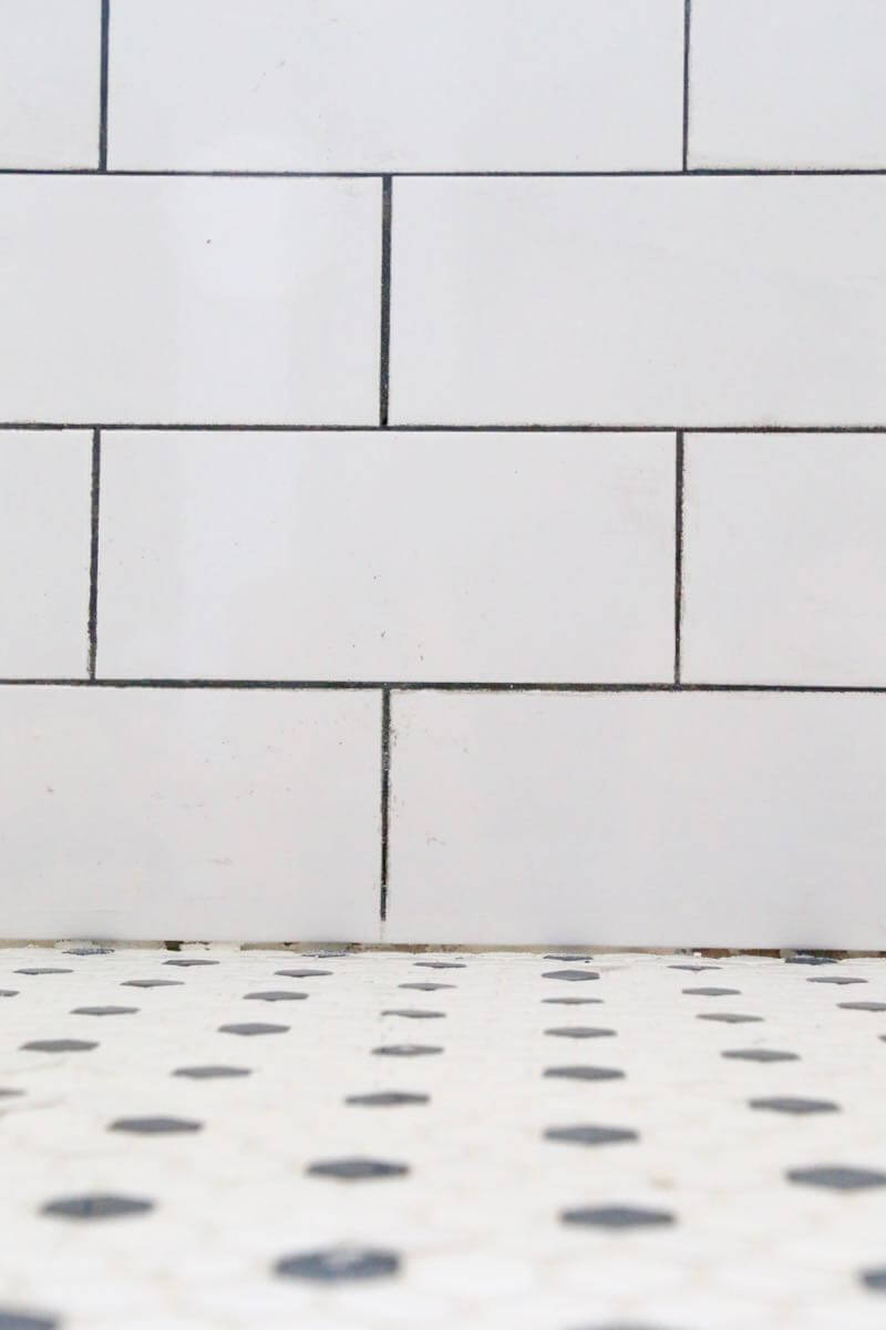 This bathroom renovation is going to be amazing. The black and white tile in this room is so clean and modern! There are some great tips for tiling in this post, too. This One Room Challenge makeover is going to be absolutely amazing.