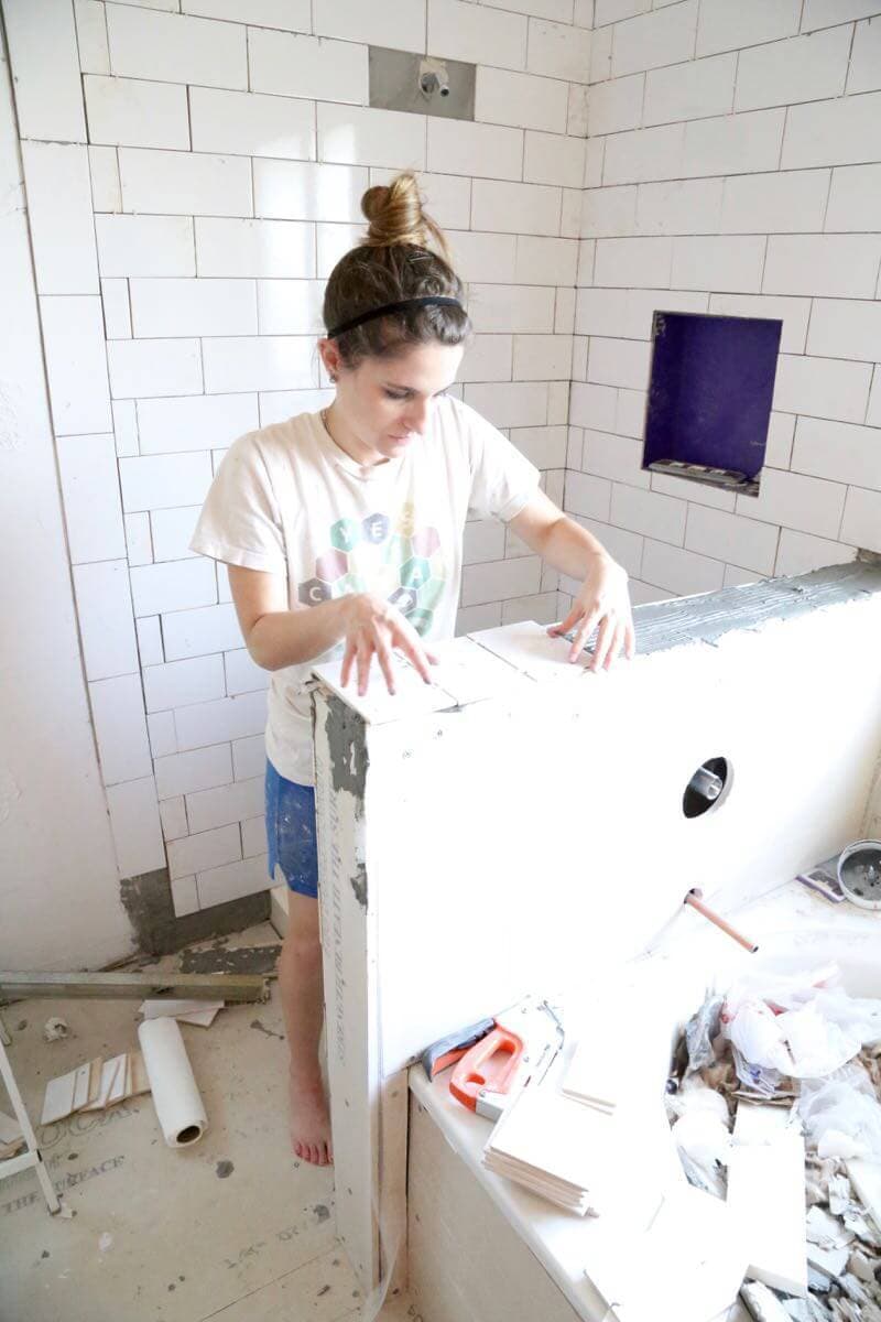 This bathroom renovation is going to be amazing. The black and white tile in this room is so clean and modern! There are some great tips for tiling in this post, too. This One Room Challenge makeover is going to be absolutely amazing.