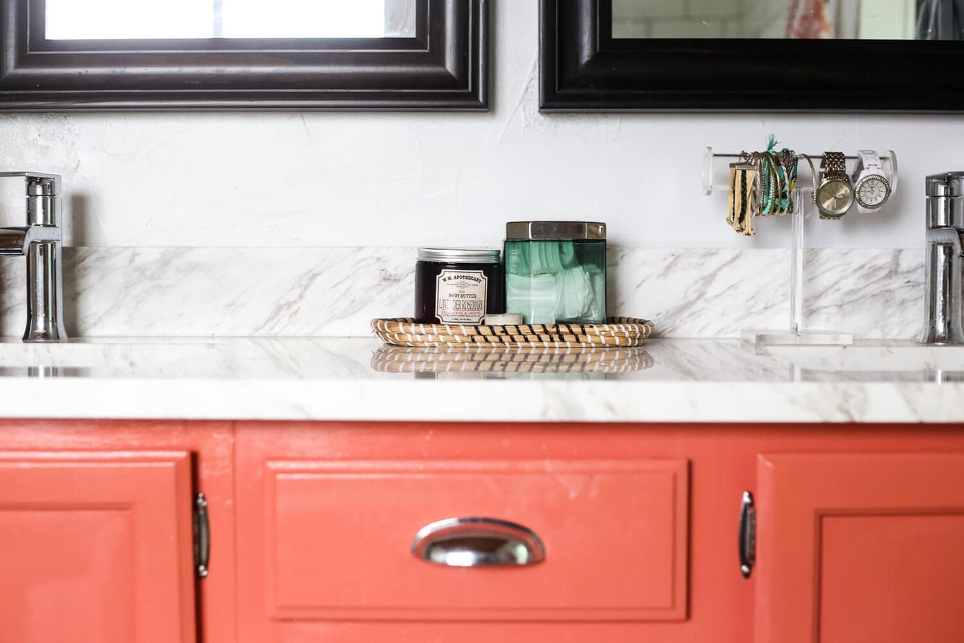 Close-up of coral vanity with quartz countertop. 