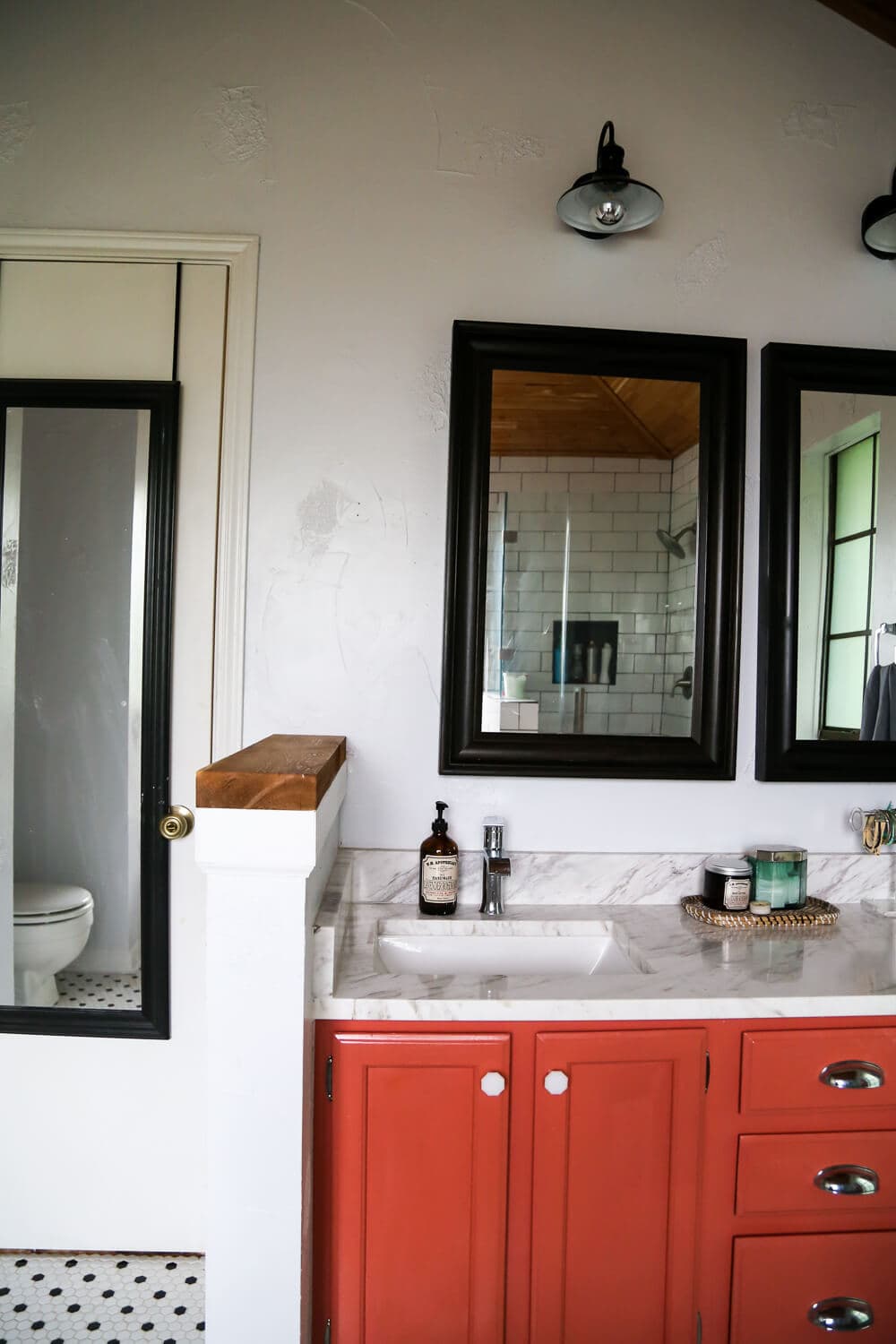 This master bathroom remodel is absolutely gorgeous. SO many inspiring ideas, gorgeous black and white tile, and it's all one big DIY renovation! You HAVE to see the rest of the photos!