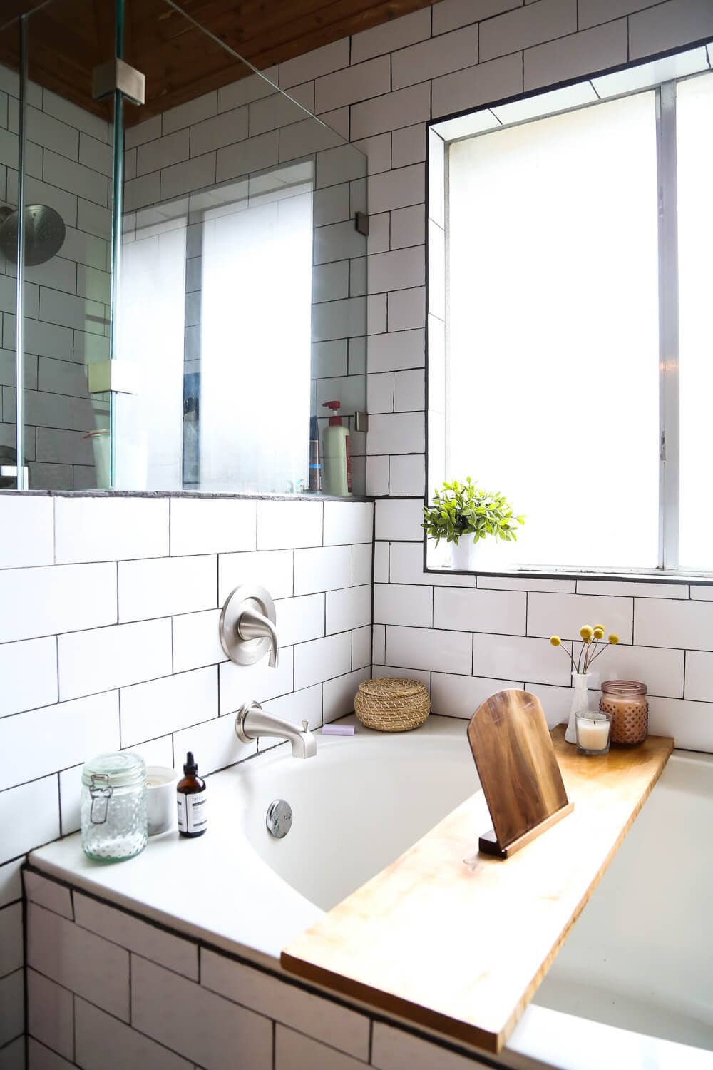 How to remodel a bathroom - ideas for a bathroom remodel with white subway tile, a large shower, and cedar planked ceiling