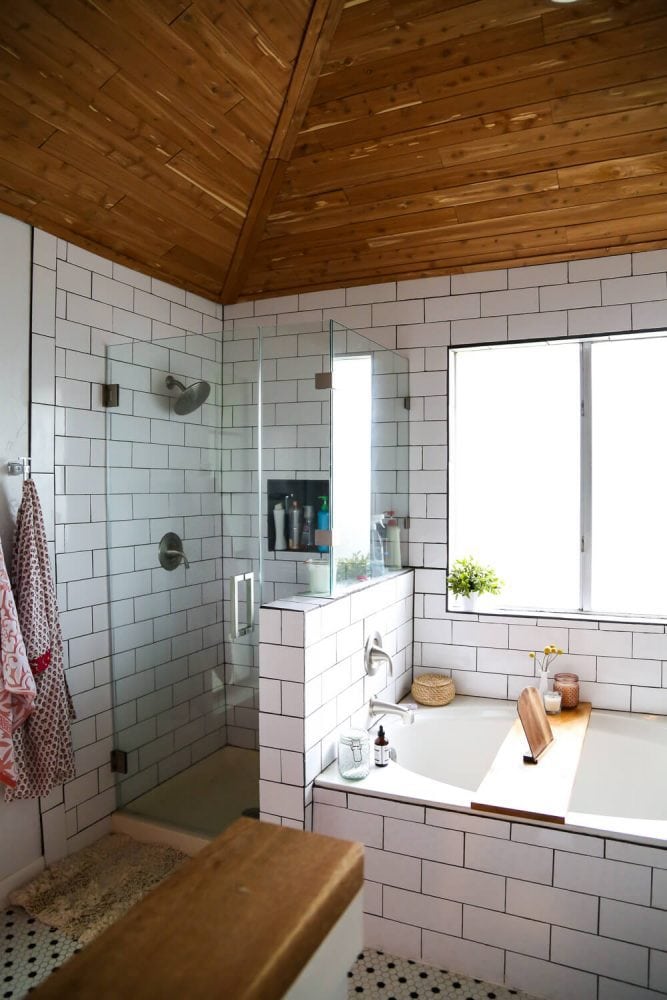 bathroom with subway tile and a cedar ceiling