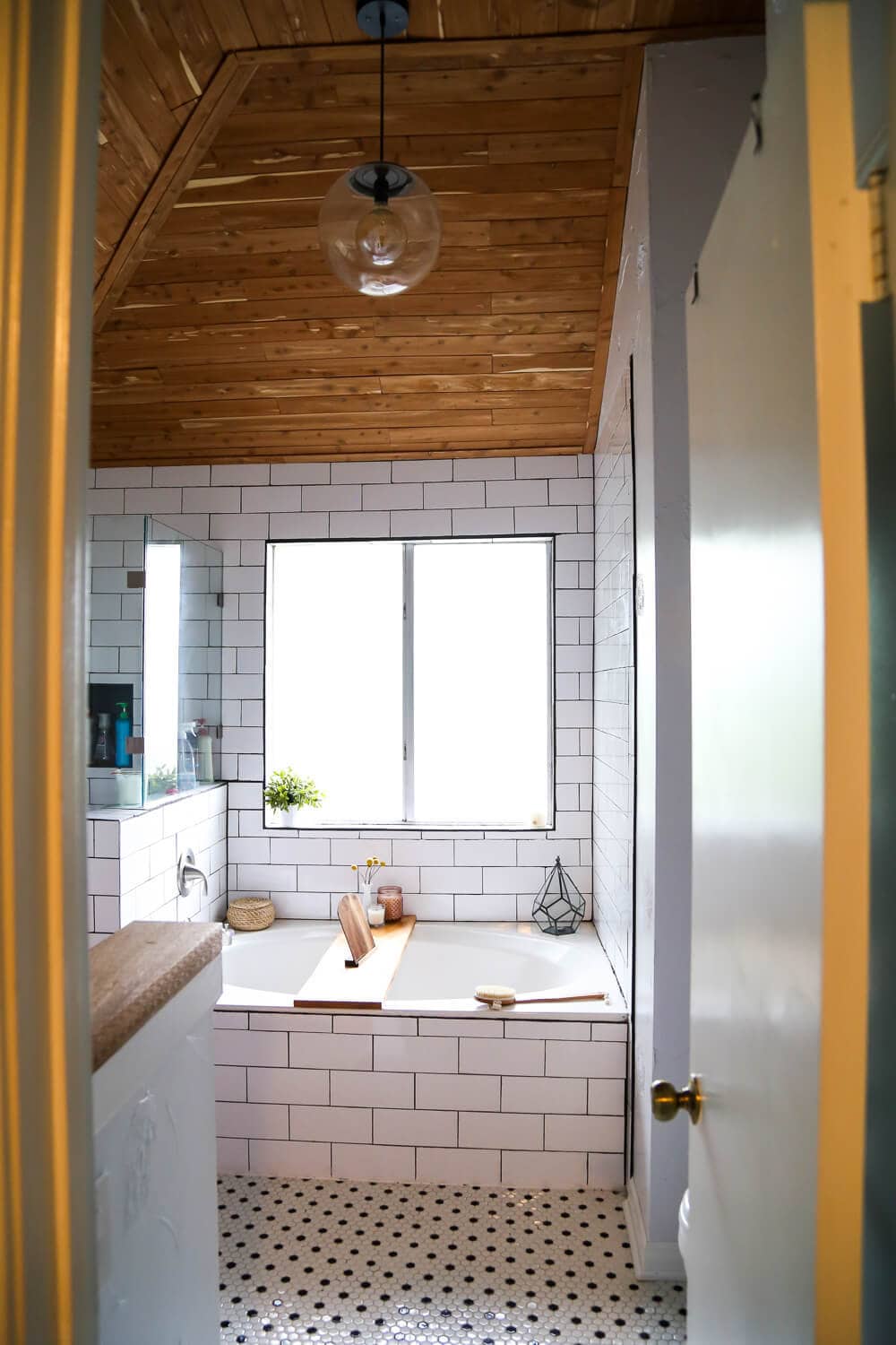 Master bathroom renovation with cedar planked ceiling and large soaking tub