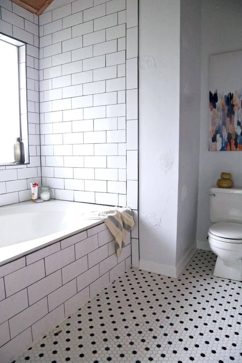 This master bathroom remodel is absolutely gorgeous. SO many inspiring ideas, gorgeous black and white tile, and it's all one big DIY renovation! You HAVE to see the rest of the photos!