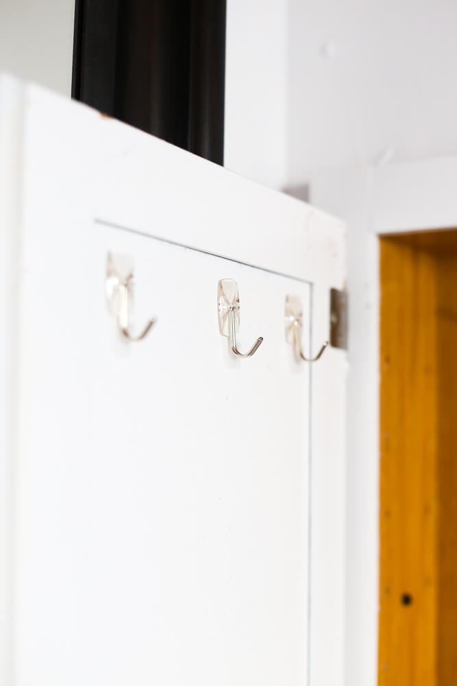 Command hooks in medicine cabinet
