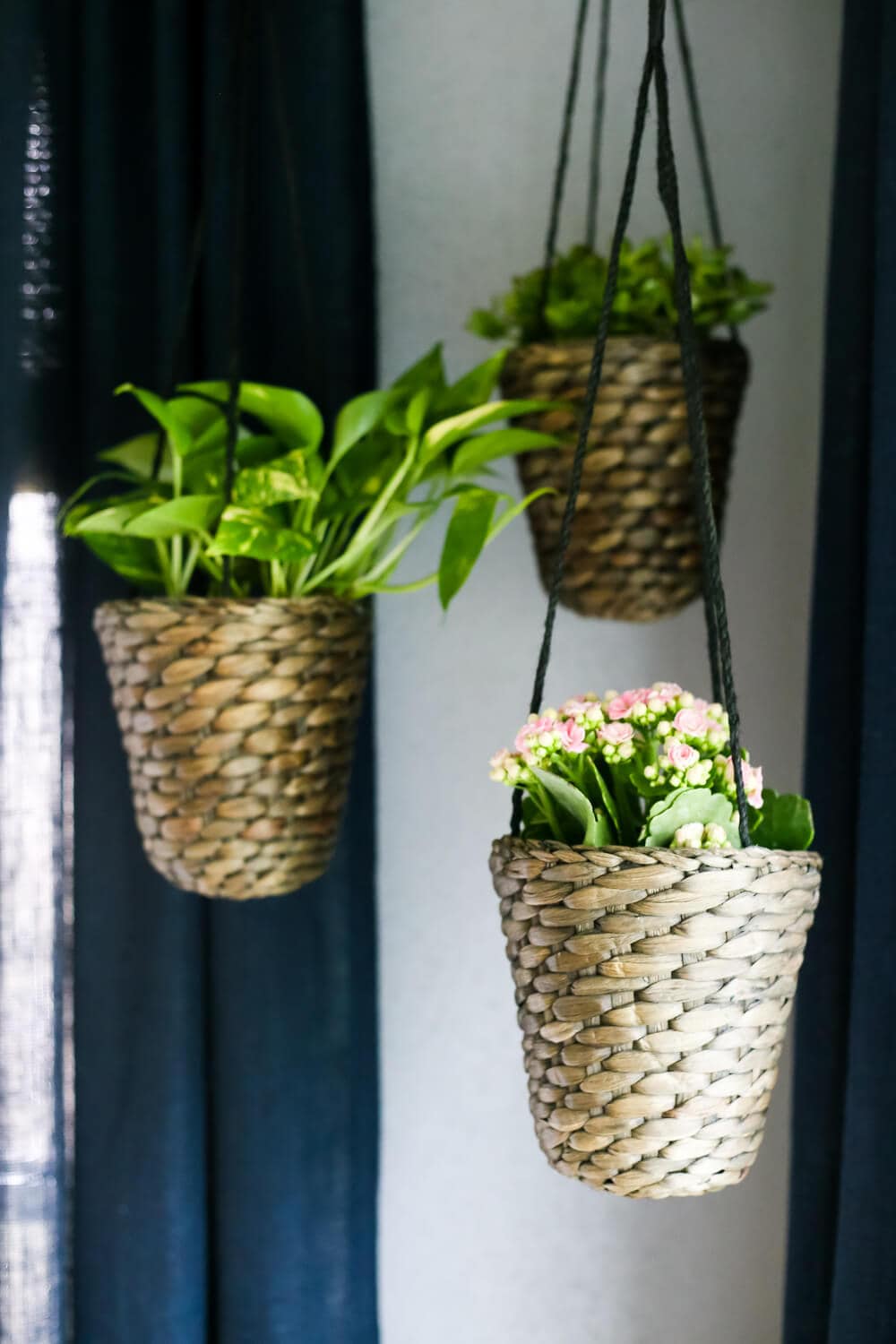 How to add simple hanging planters from IKEA to create this DIY indoor hanging planter display. It's a really simple idea, but makes a big statement in your room! 