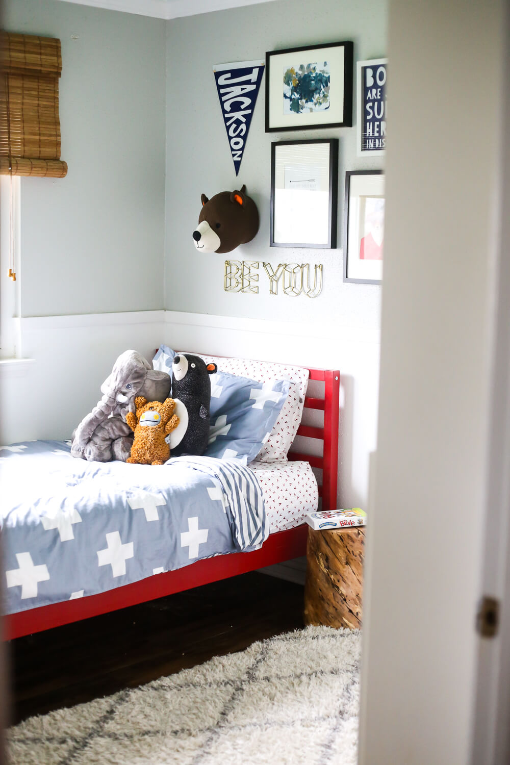 red painted bed in a gender-neutral toddler's bedroom - how to paint furniture