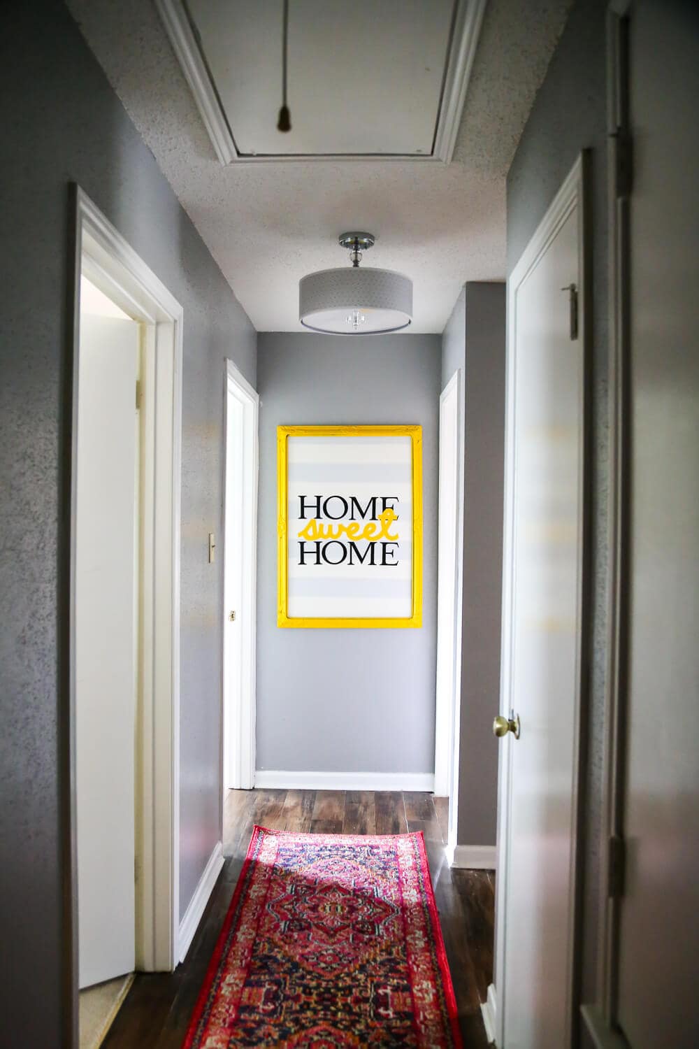 A quick, easy, and gorgeous hallway update. Sometimes all it takes is a new runner and some pretty lights to make a major difference! 