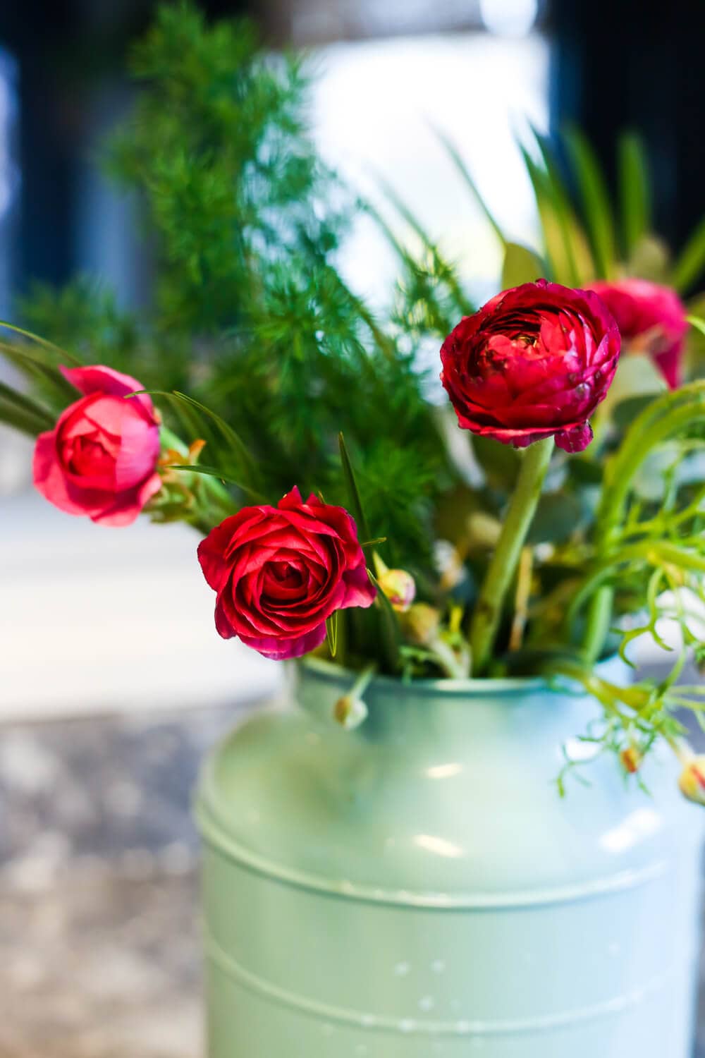 Ideas for how to take a cheap bouquet of flowers from the grocery store and turn it into a gorgeous arrangement that looks way more expensive! It's so simple, even if you aren't great at flower arranging! 