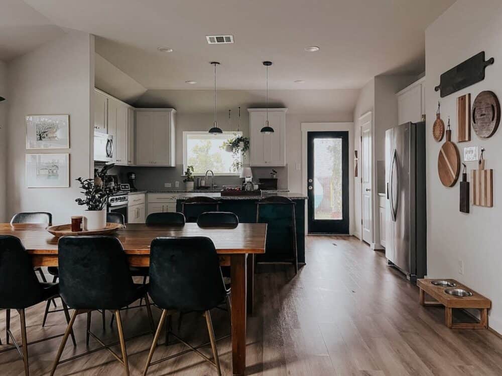 kitchen and dining room with a cutting. board accent wall 