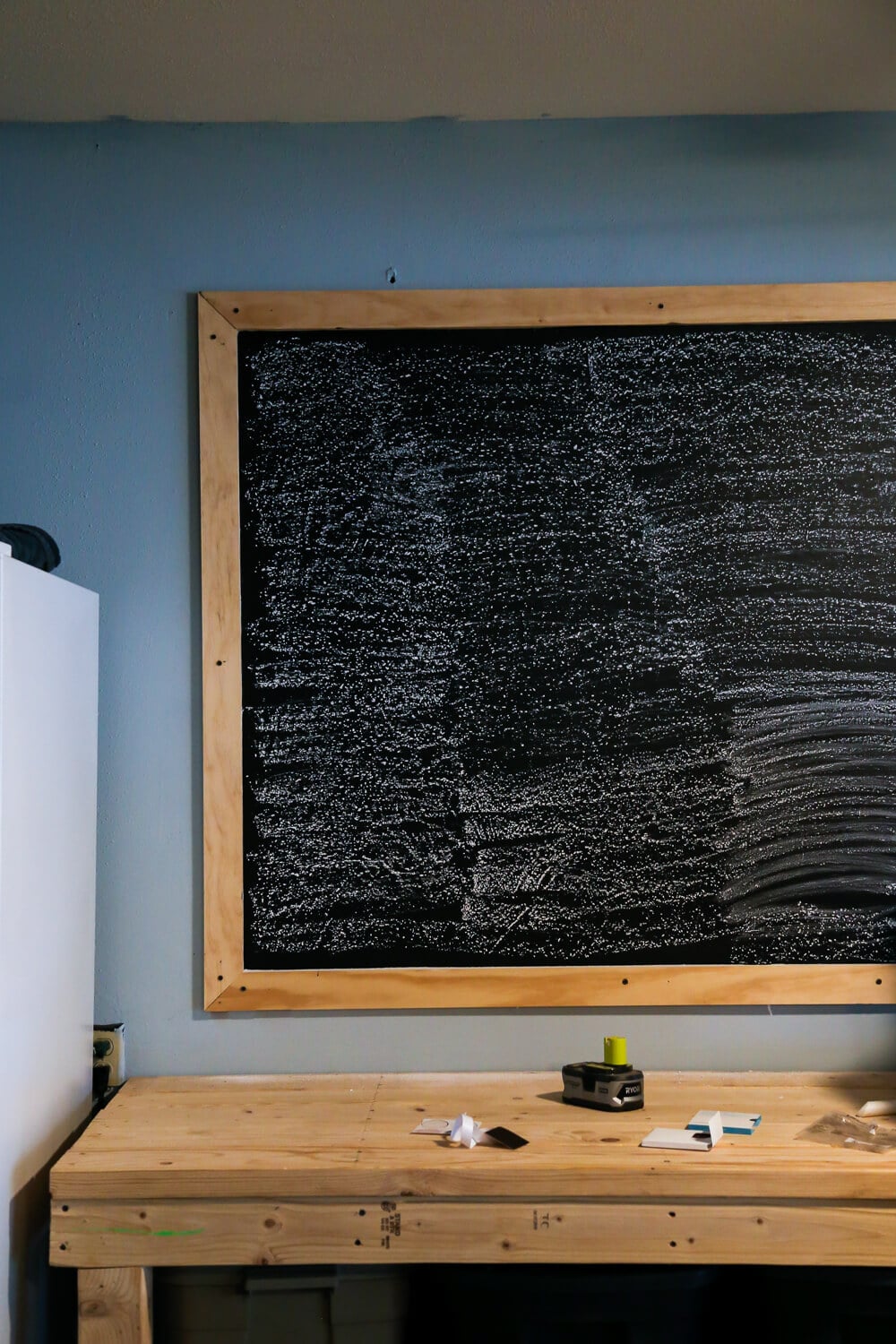 Prepping DIY chalkboard for use