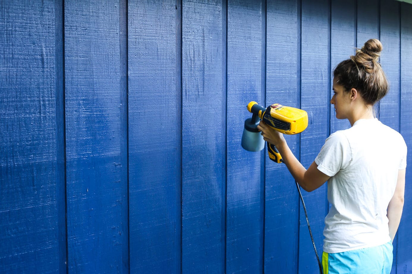 How to paint an exterior building using a paint sprayer - it will make a huge difference in how your entire yard looks and feels! 