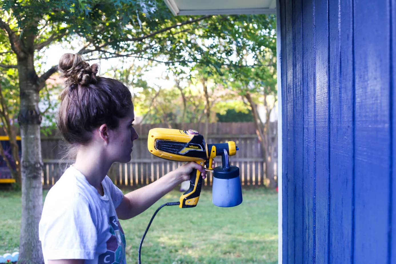 How to paint an exterior building using a paint sprayer - it will make a huge difference in how your entire yard looks and feels! 