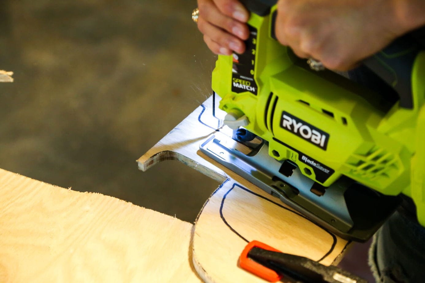 close up of a Ryobi jigsaw being used 