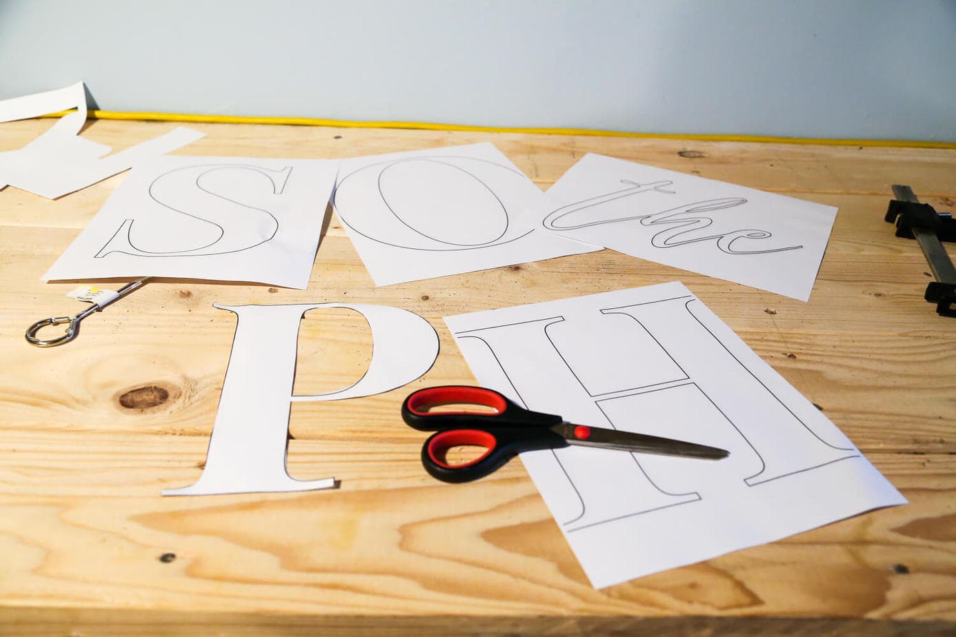 How to make a wooden sign to hang in your home using a jigsaw to cut out the letters. Really cute idea for an outdoor building, a bedroom, or anywhere else in the house! 