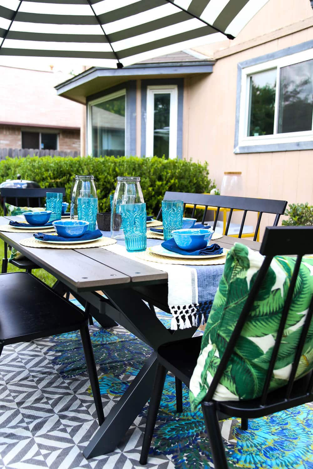 This patio is so gorgeous and cozy - and everything out here is so affordable! There are some great ideas for making a small patio feel spacious, and tips for choosing outdoor furniture. 