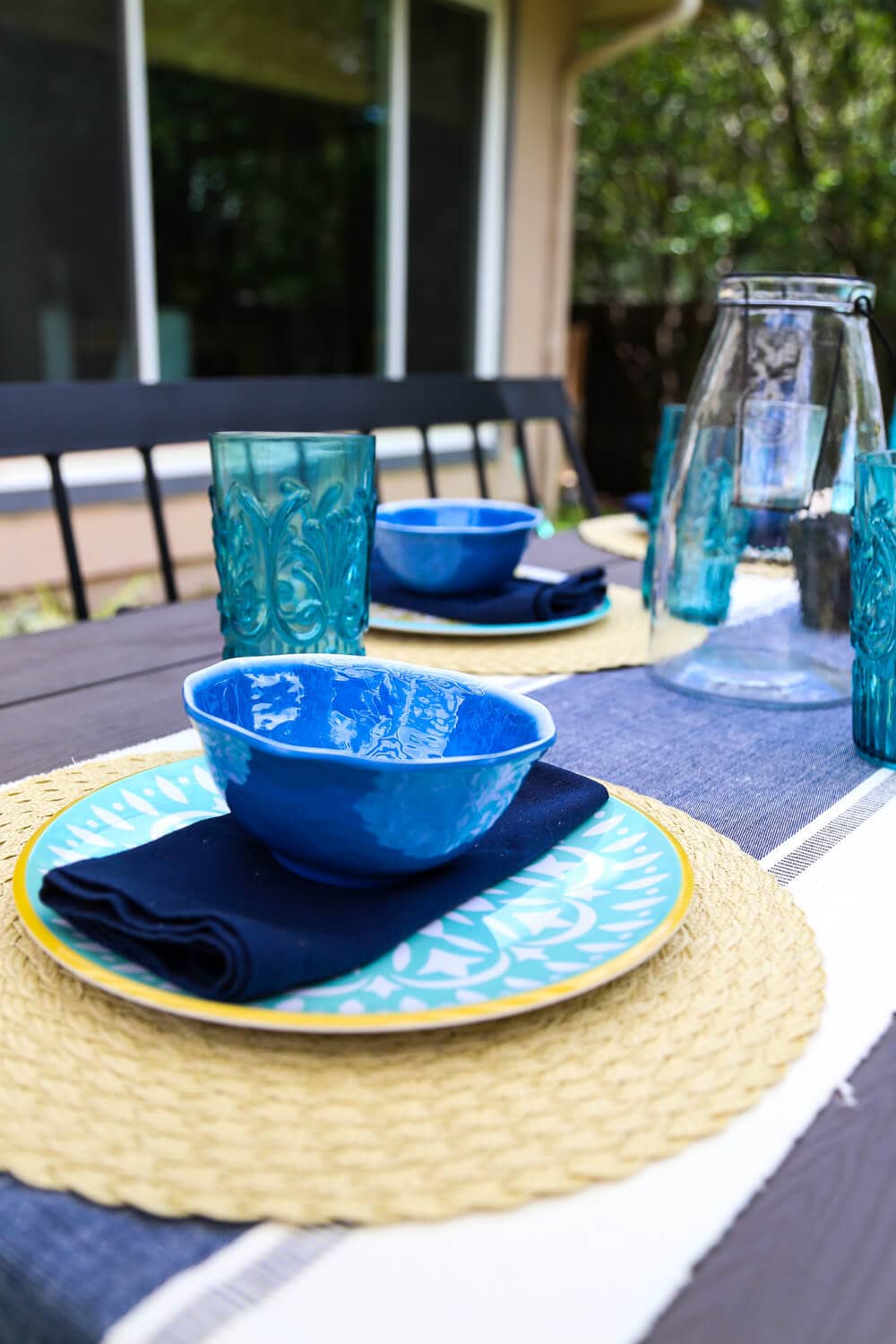 This patio is so gorgeous and cozy - and everything out here is so affordable! There are some great ideas for making a small patio feel spacious, and tips for choosing outdoor furniture. 