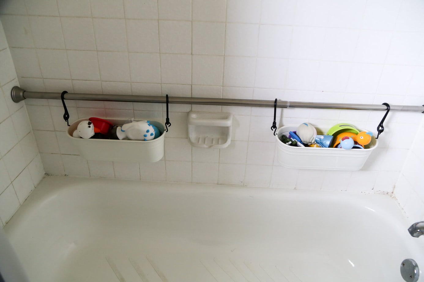 How to organize your bath toys in an attractive and affordable way using the FINTORP hanging baskets from IKEA. No more dripping toys in the middle of your bathtub! 