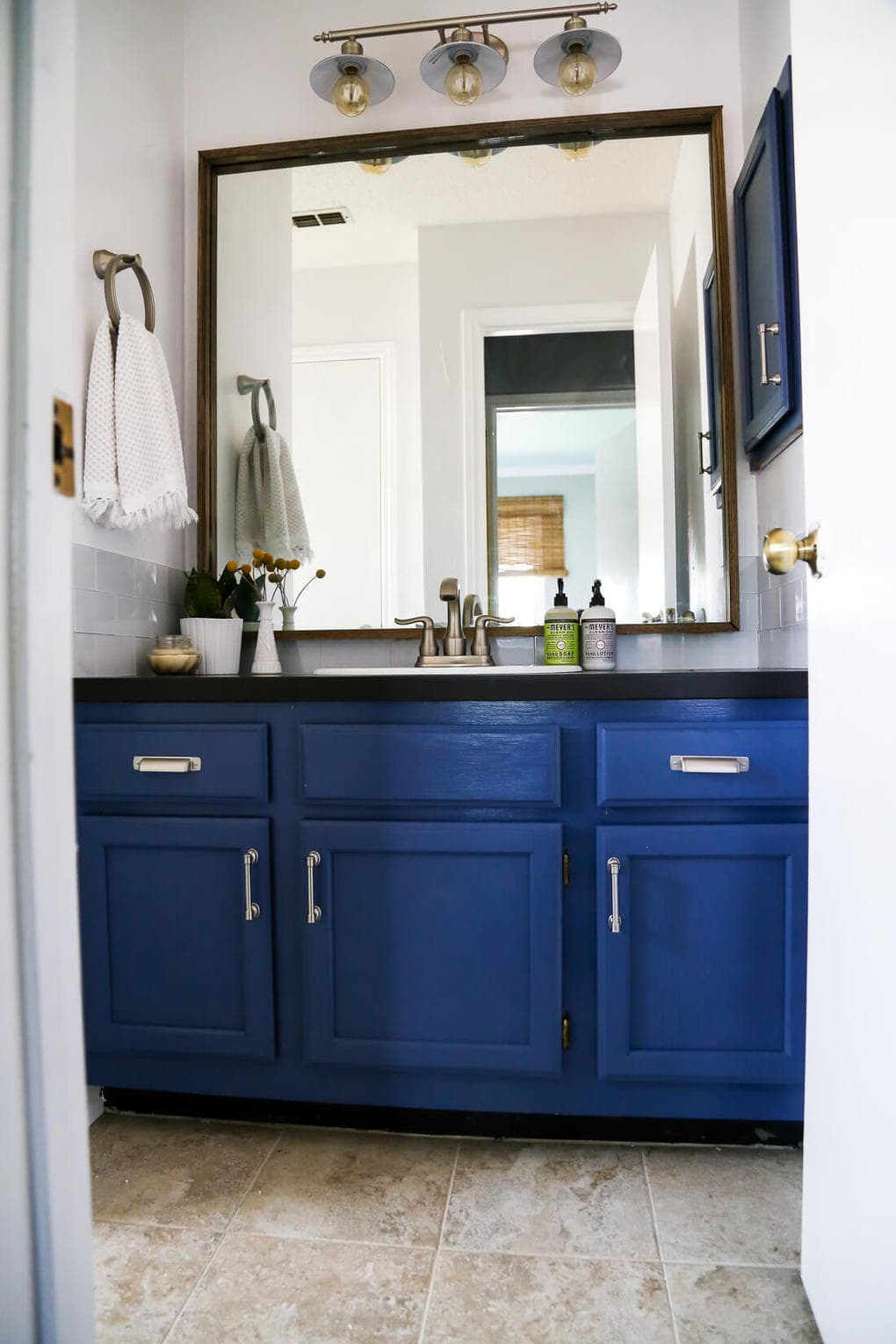 A DIY modern, serene bathroom renovation that can be completed in a weekend. Great ideas for how to upgrade an ugly bathroom and make it look like new without a ton of time or money. 