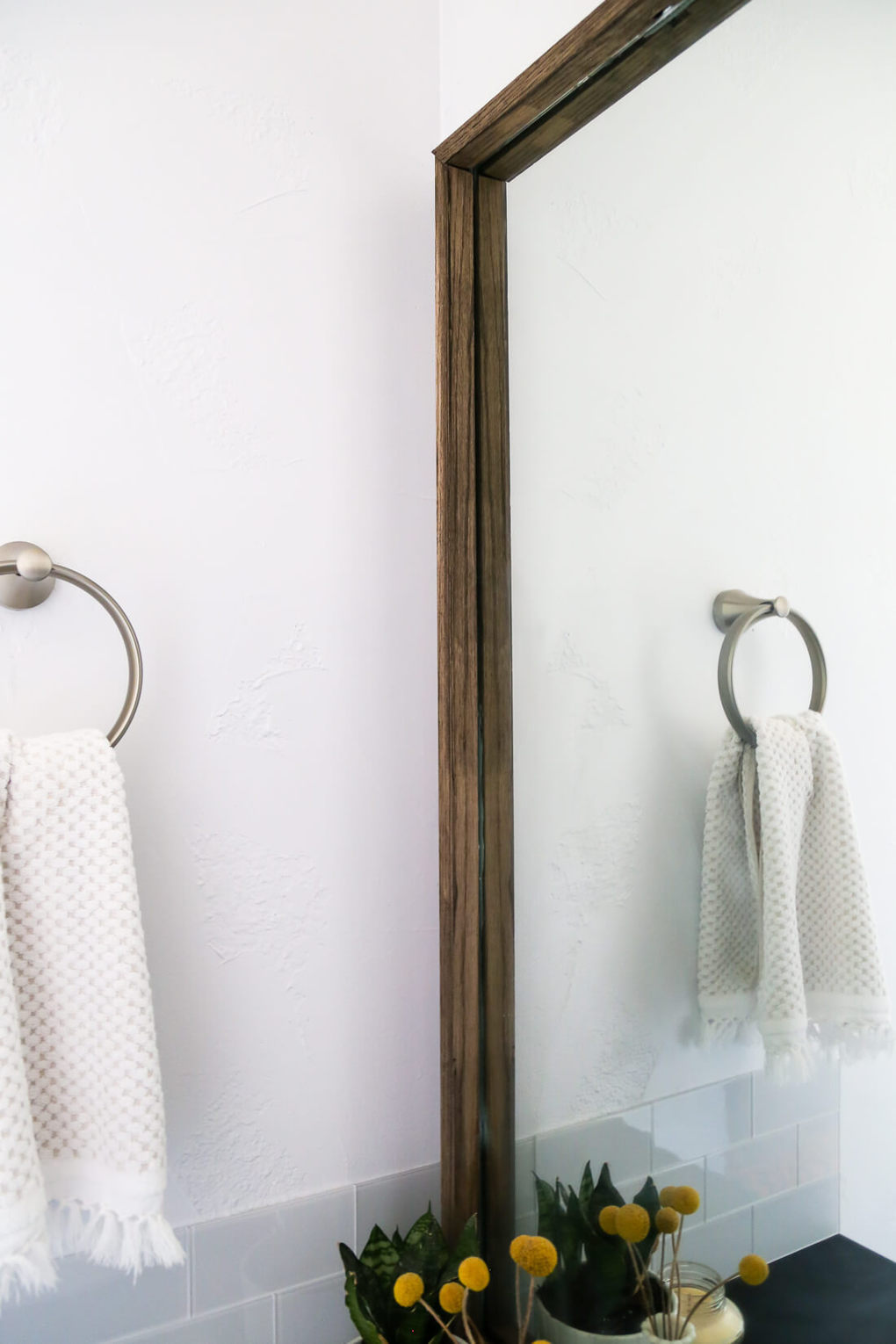 How to quickly and easily frame a bathroom mirror, to take your bathroom from builder-grade to completely custom!