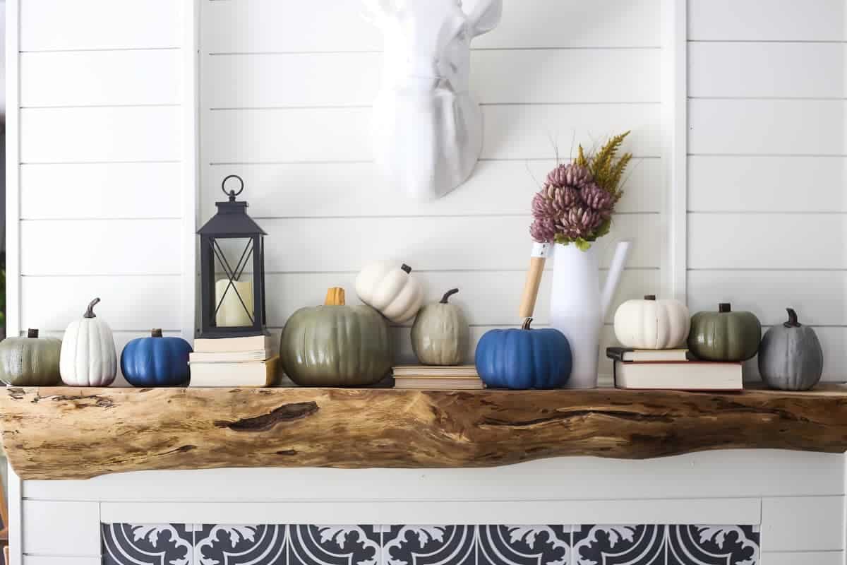 DIY painted faux pumpkins on a fireplace mantel