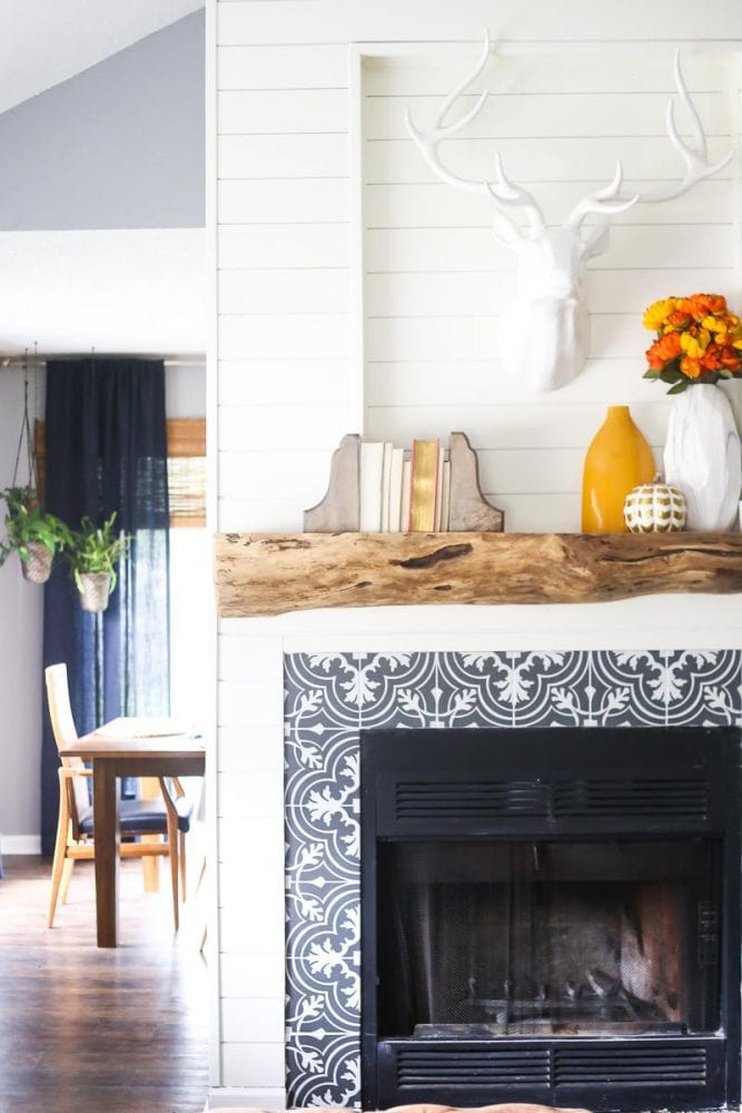 fireplace with shiplap and bold black and white tile