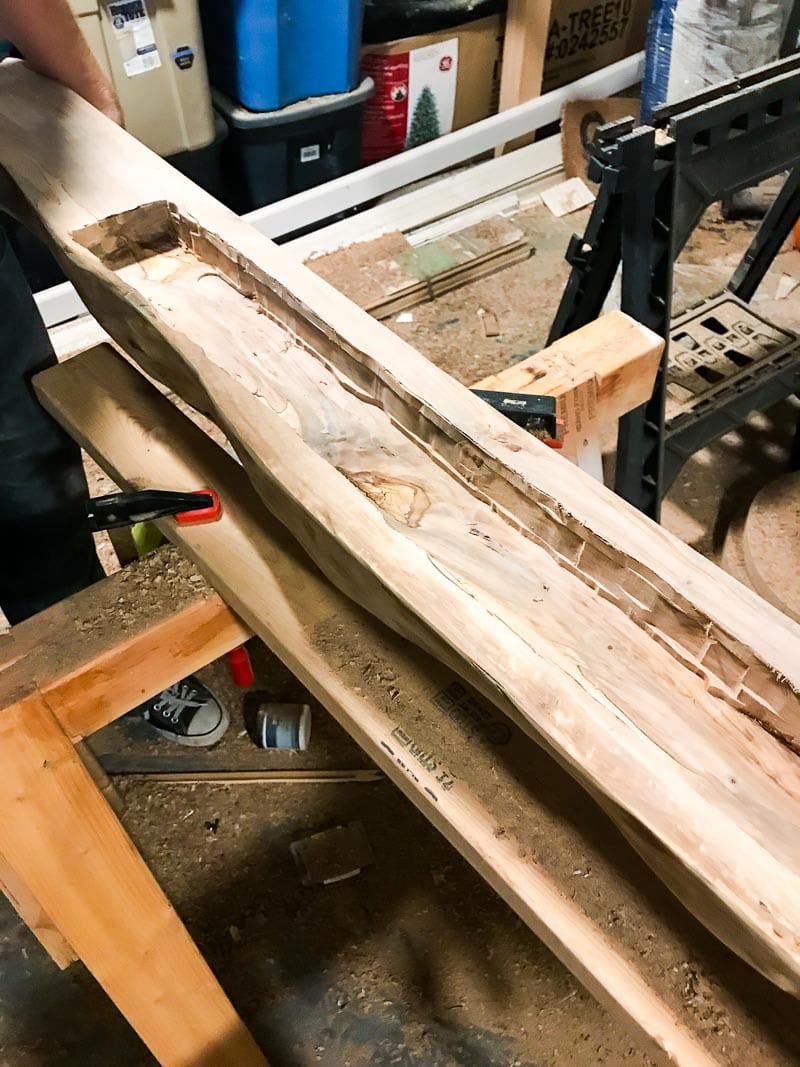 groove cut in the back of a mantel to hang it 