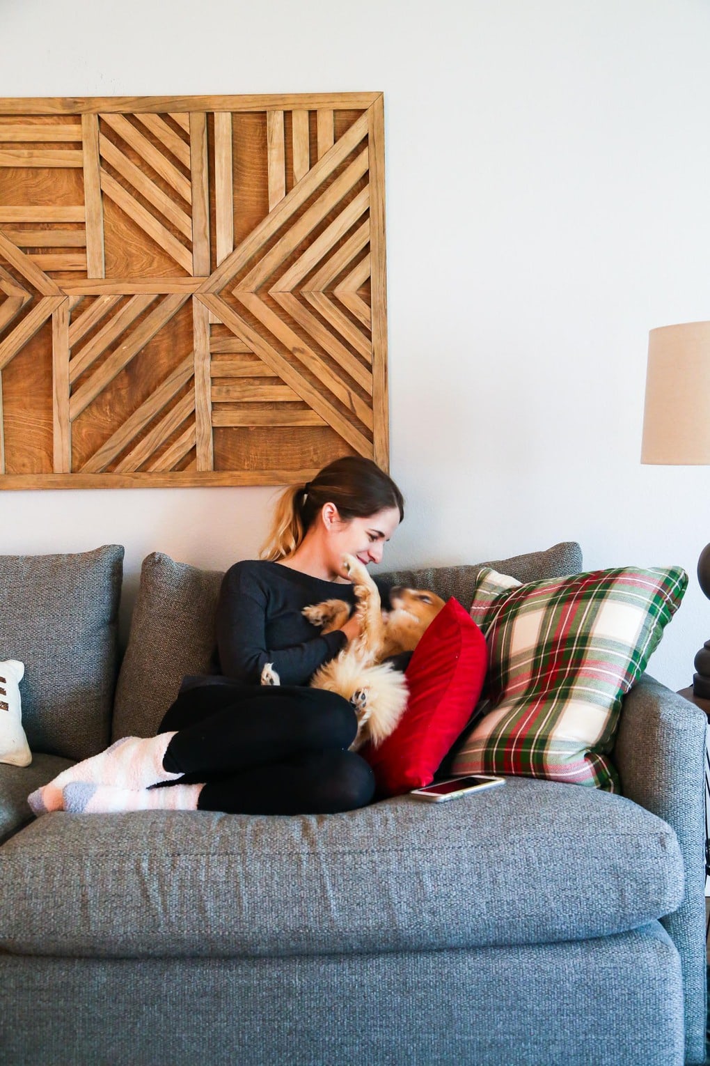 Woman on couch with dog - tips for moving and selling a home