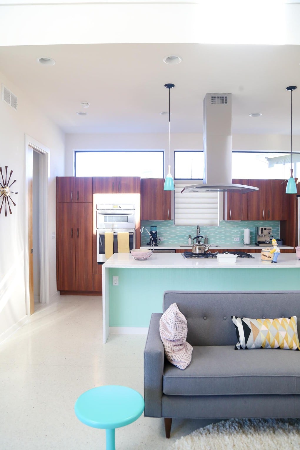 A mid-century modern living room and kitchen designed by Starlight Village in Leander