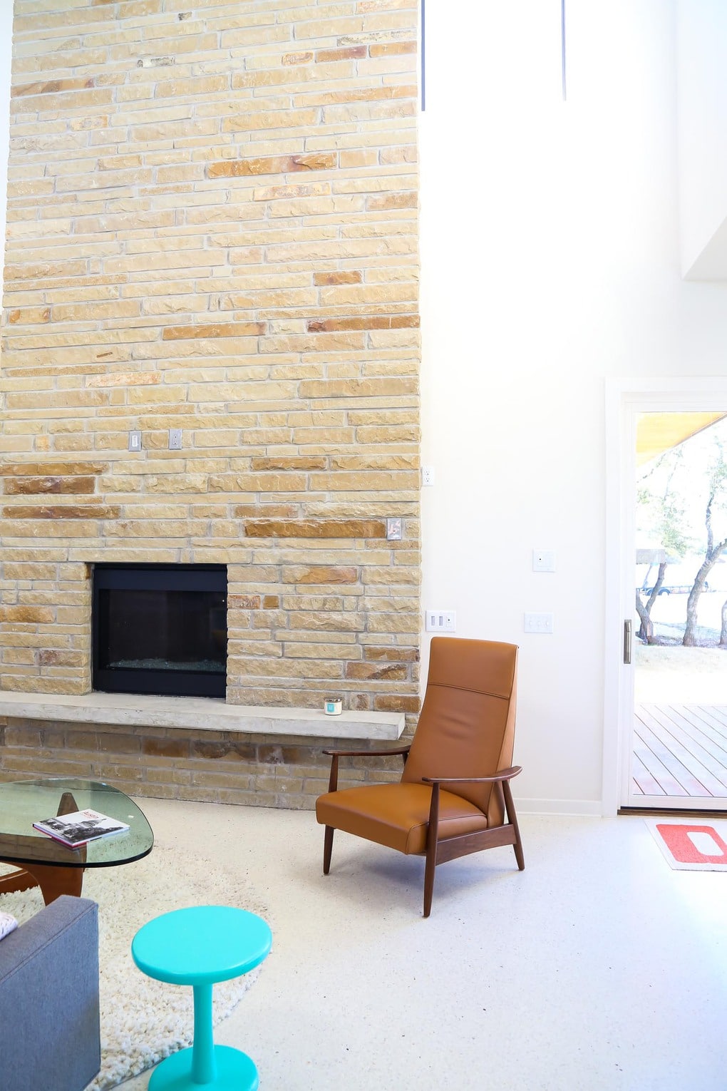 Stone fireplace - gorgeous midcentury modern homes in Starlight Village in Austin