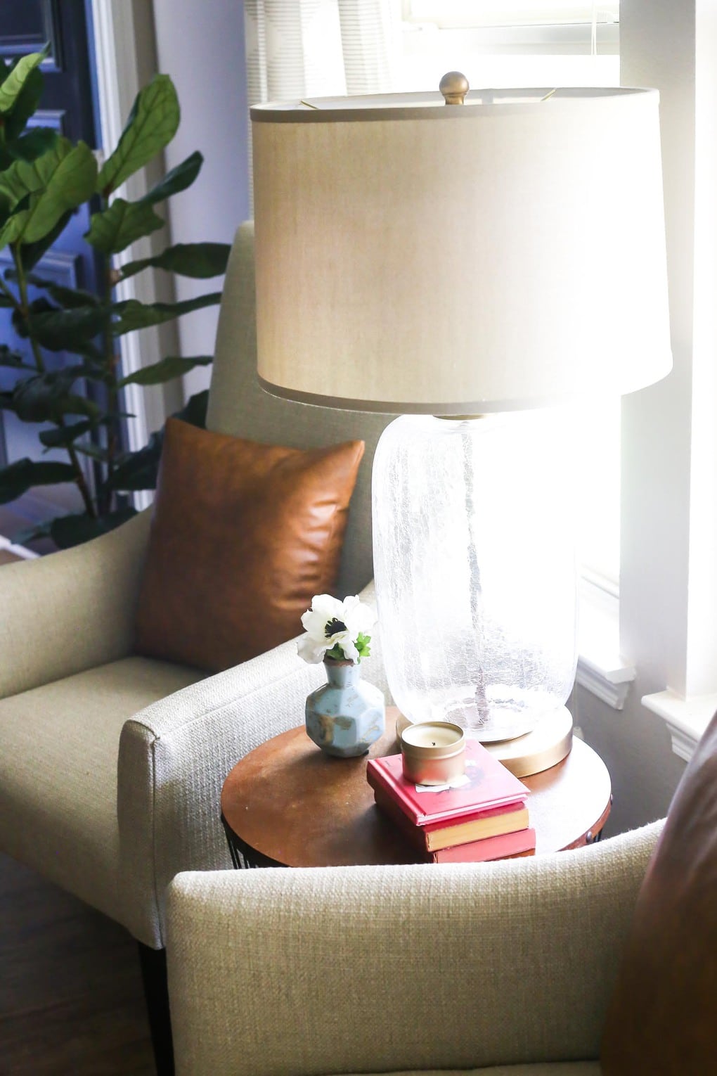 Glass table lamp and white chair