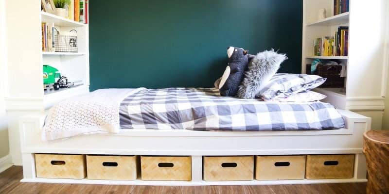 White built in bedding and shelves with gray buffalo check bedding