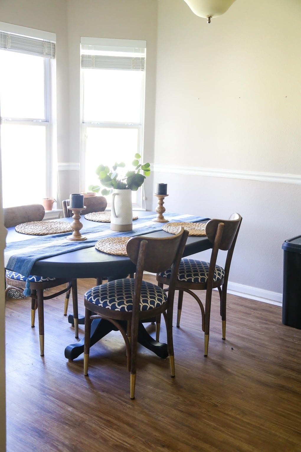 Black dining table with four chairs