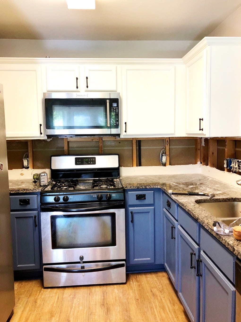 Removing old drywall to replace kitchen backsplash