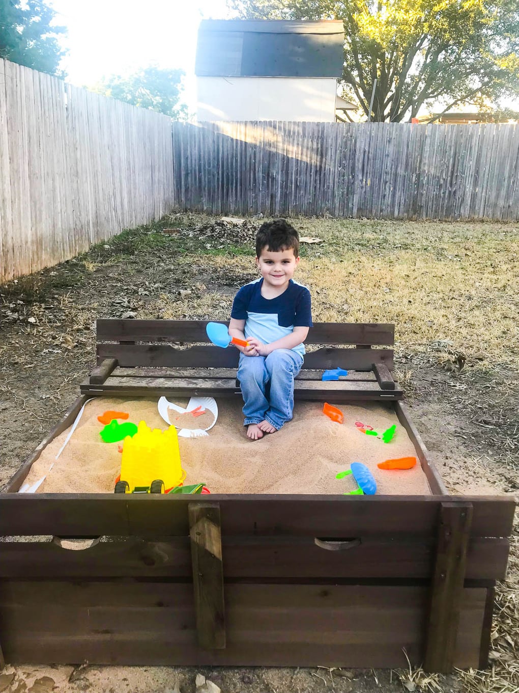 Backyard sand box with bench