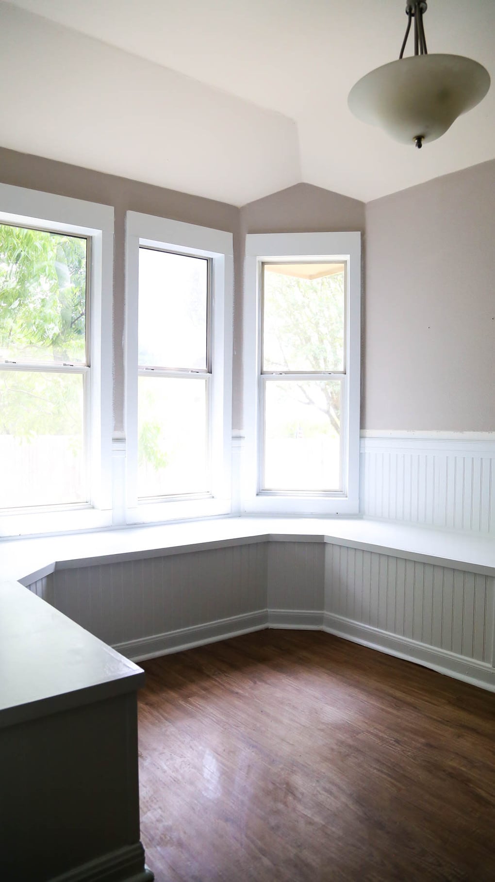 Bay window seating in a small dining nook